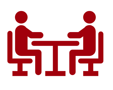 Icône rdv entre deux personnes assises à une table qui illustre l'accompagnement au changement